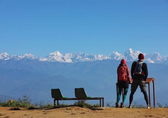 travelers viewing mountain range in Nepal